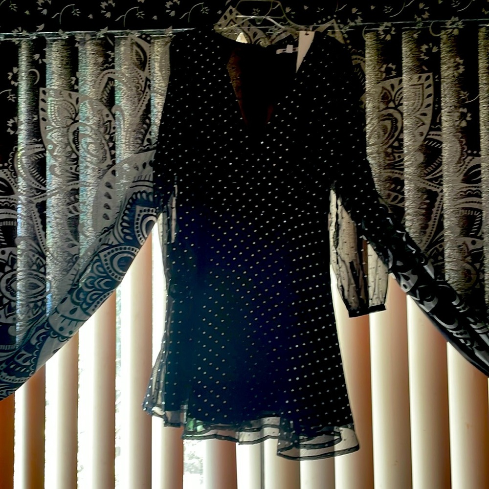 Super cute black and silver star dress. New with tags! Size 2